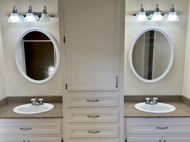 a view of cabinet and mirror