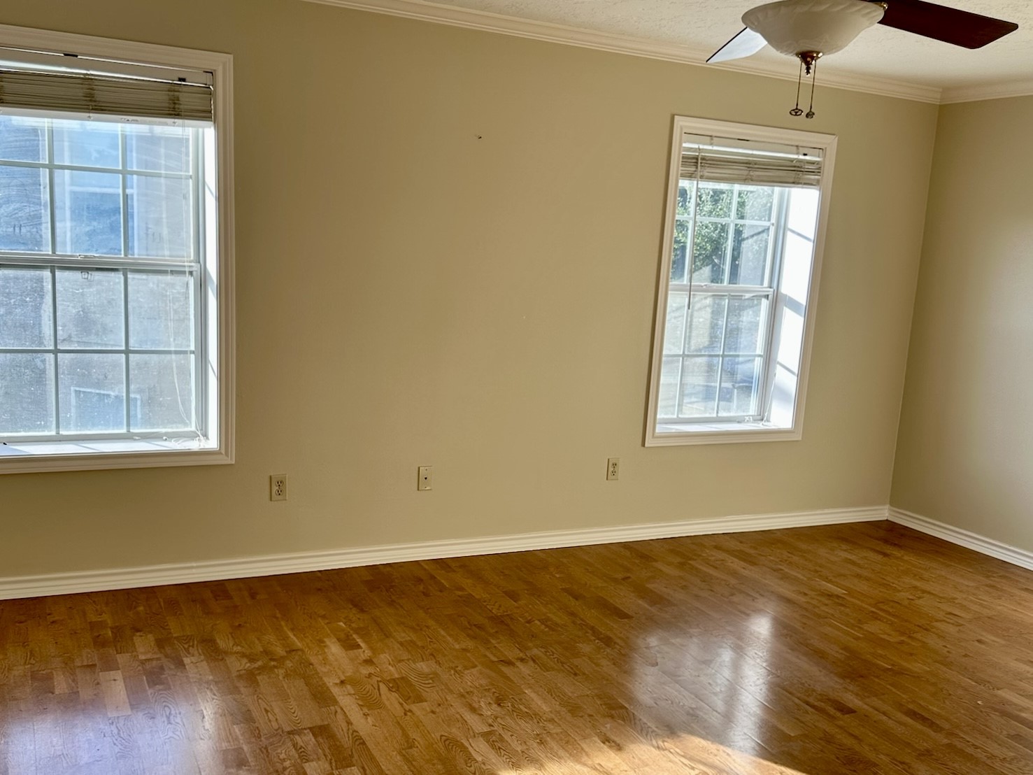 5659 Lymbar Drive Houston, TX 77096 - Photo 20 of 26 an empty room with wooden floor and windows