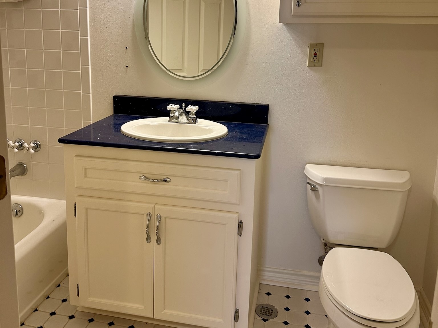 5659 Lymbar Drive Houston, TX 77096 - Photo 22 of 26 a bathroom with a toilet a sink and a mirror