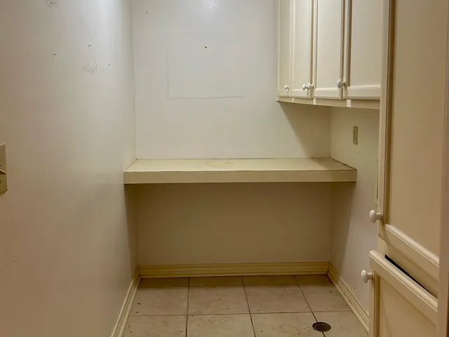 a view of a pathway with a house in the background