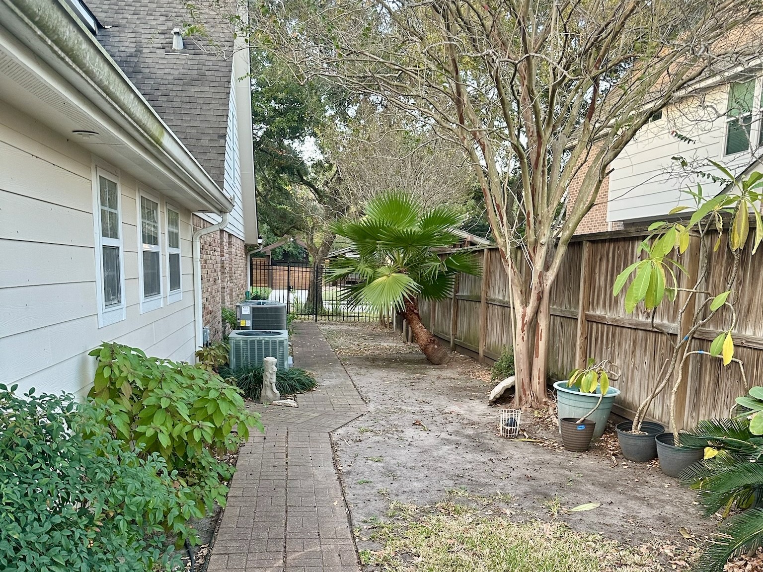 5659 Lymbar Drive Houston, TX 77096 - Photo 25 of 26 a view of a pathway with a house in the background