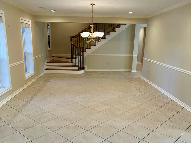 an entryway in a hall with a window