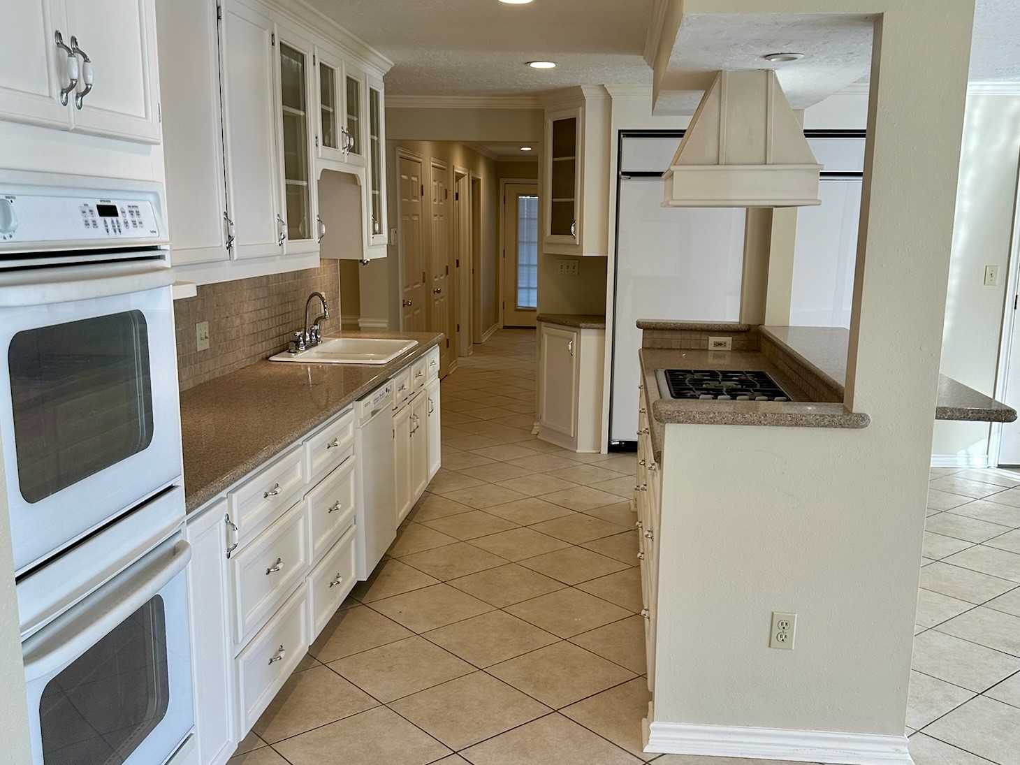 5659 Lymbar Drive Houston, TX 77096 - Photo 4 of 26 a kitchen with granite countertop a sink stove and cabinets