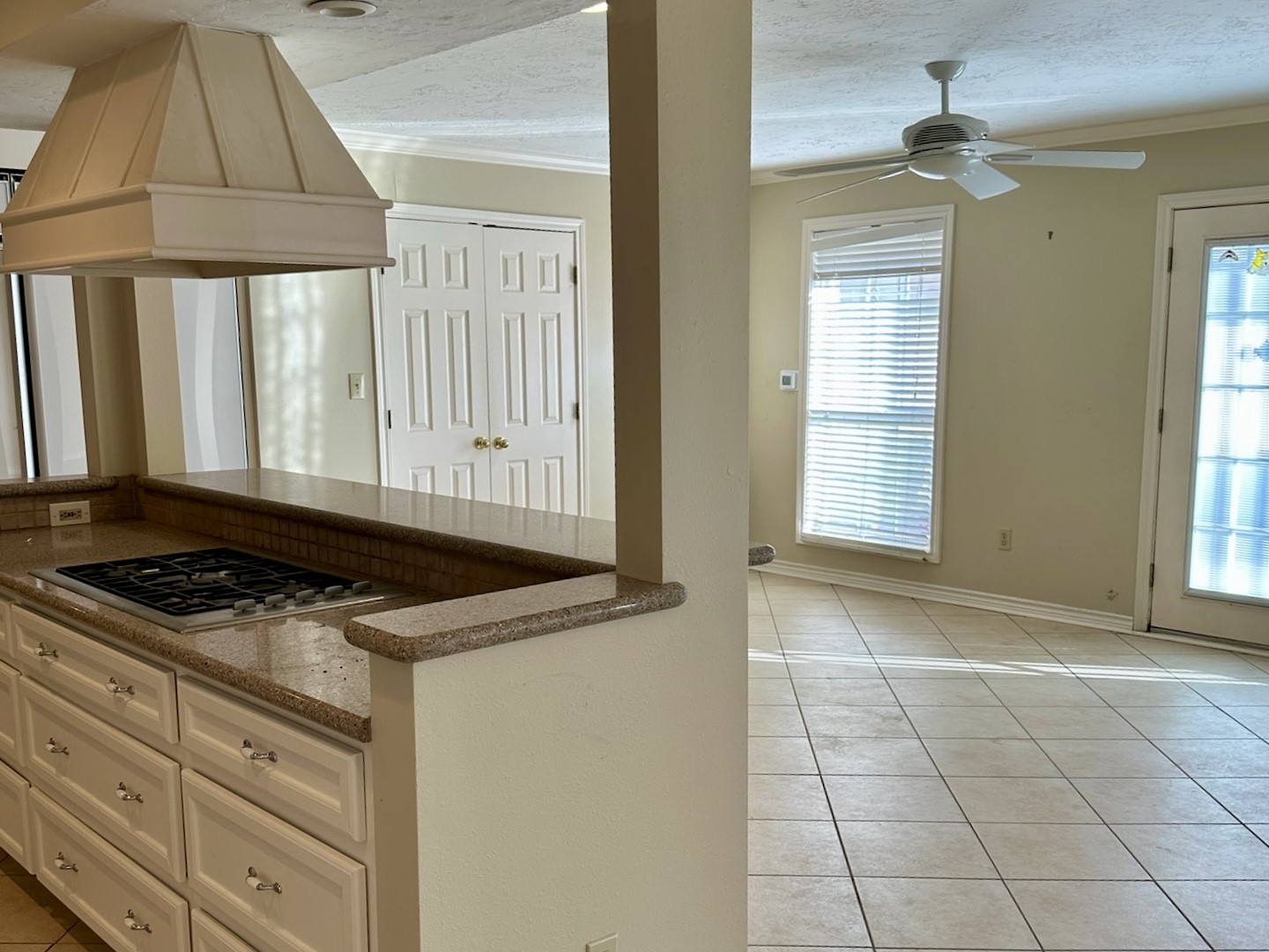 5659 Lymbar Drive Houston, TX 77096 - Photo 5 of 26 a kitchen with granite countertop a stove a sink and a window