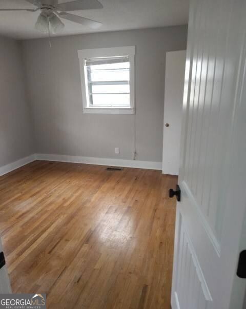 46 Mohawk Trail Ringgold, GA 30736 - Photo 11 of 16 an empty room with wooden floor and windows
