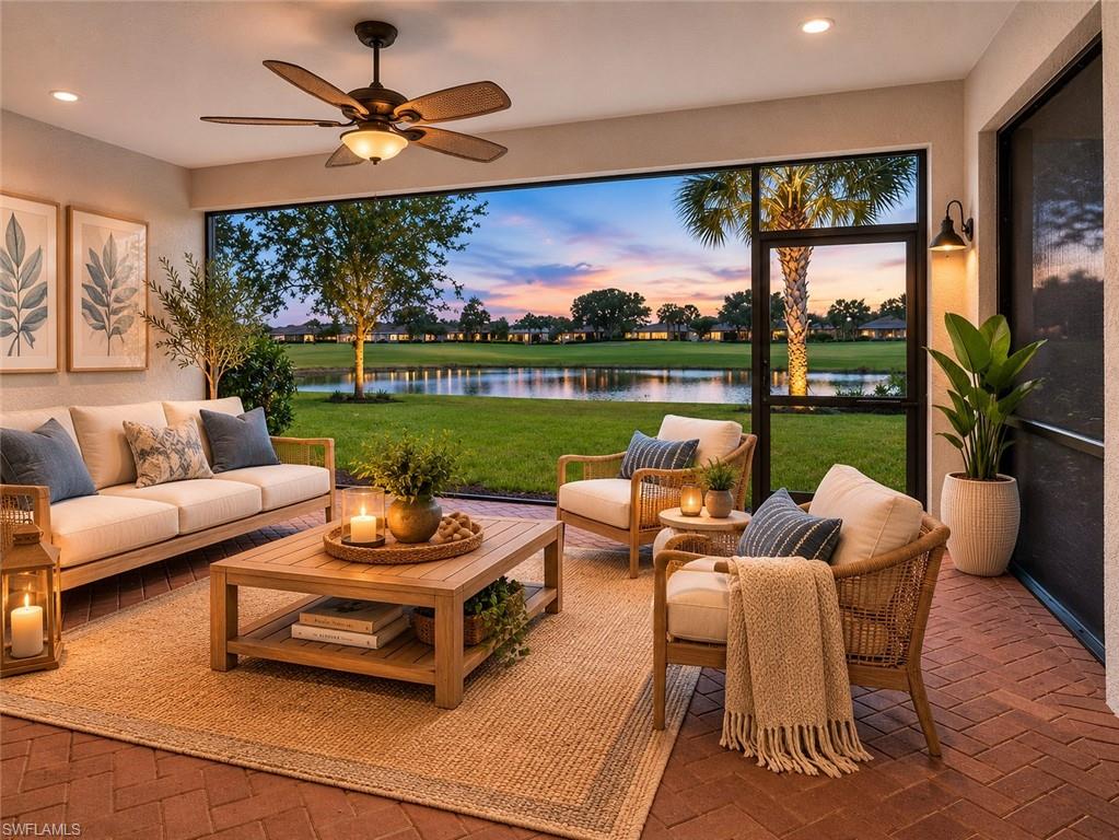 6124 Victory Drive Ave Maria, FL 34142 - Photo 4 of 50 a living room with patio furniture and a yard