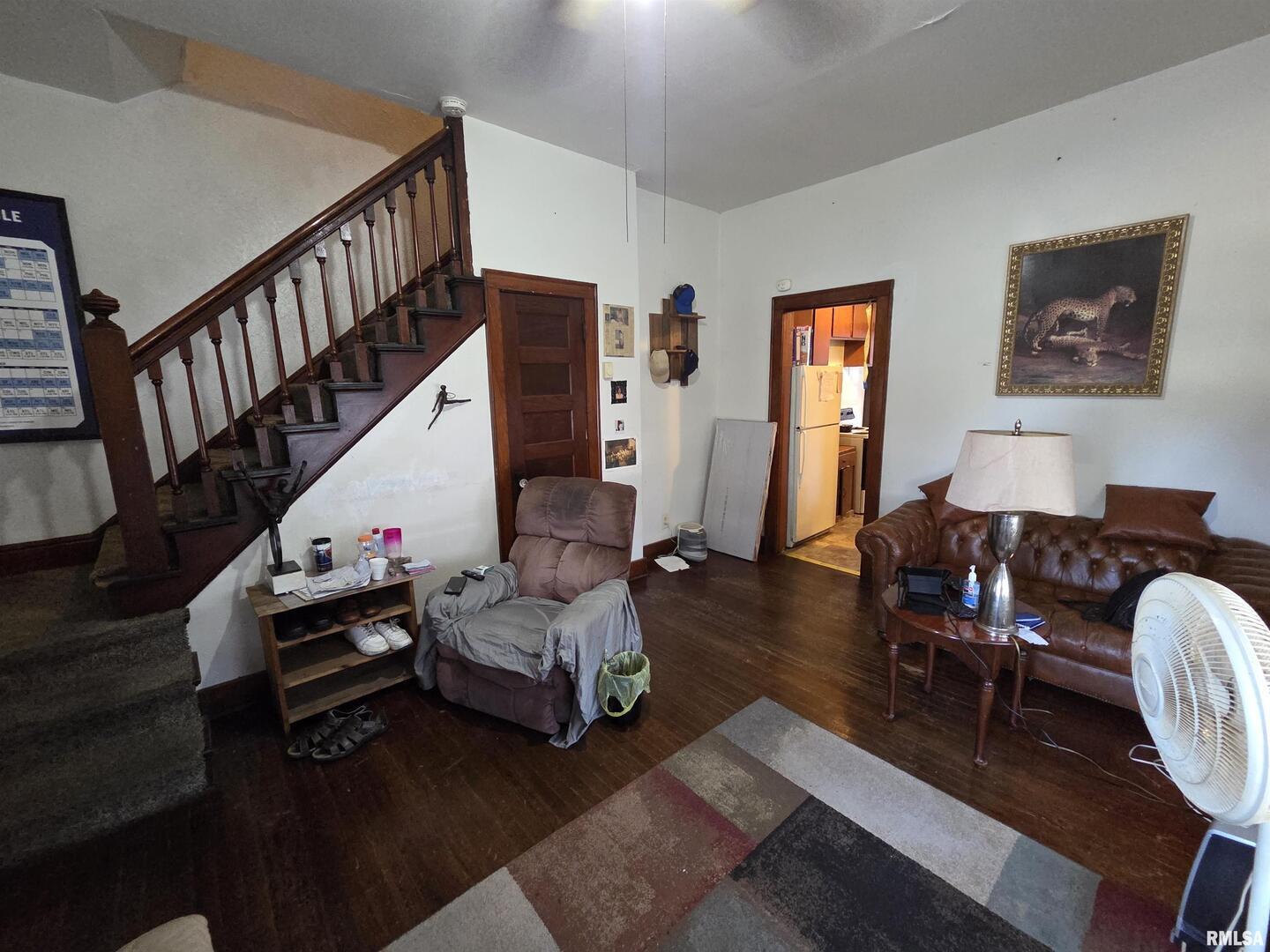 800 6th Avenue South Clinton, IA 52732 - Photo 11 of 12 a living room with furniture and wooden floor