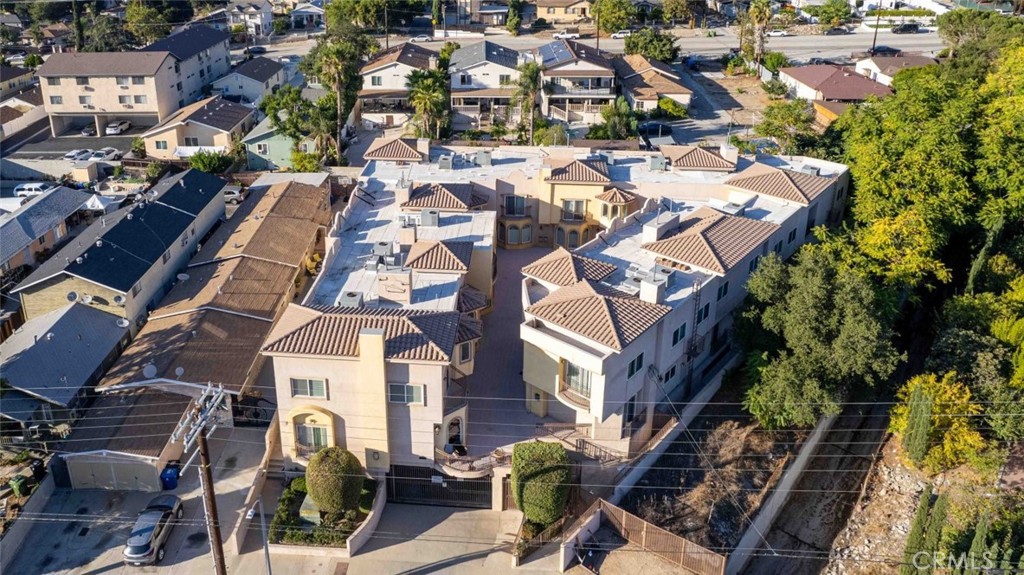 6939 Greeley Street, Unit 102 Tujunga, CA 91042 - Photo 19 of 19 an aerial view of residential houses with outdoor space