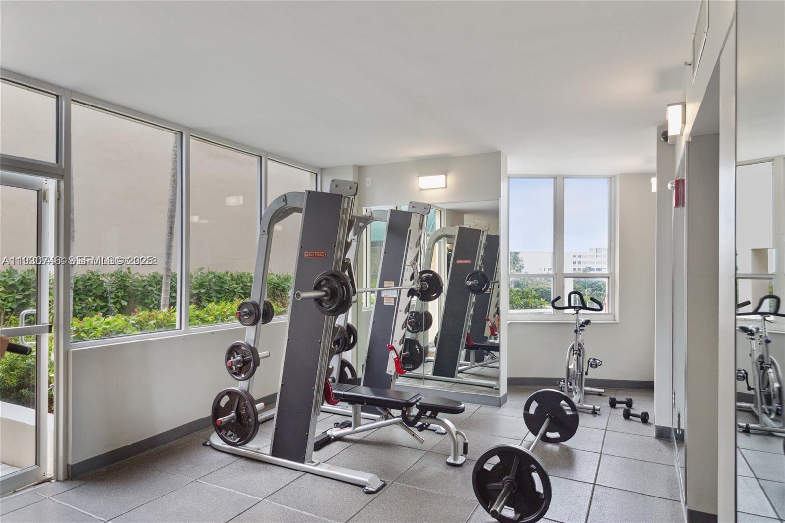 888 Brickell Key Drive, Unit 601 Miami, FL 33131 - Photo 22 of 36 a view of a room with gym equipment