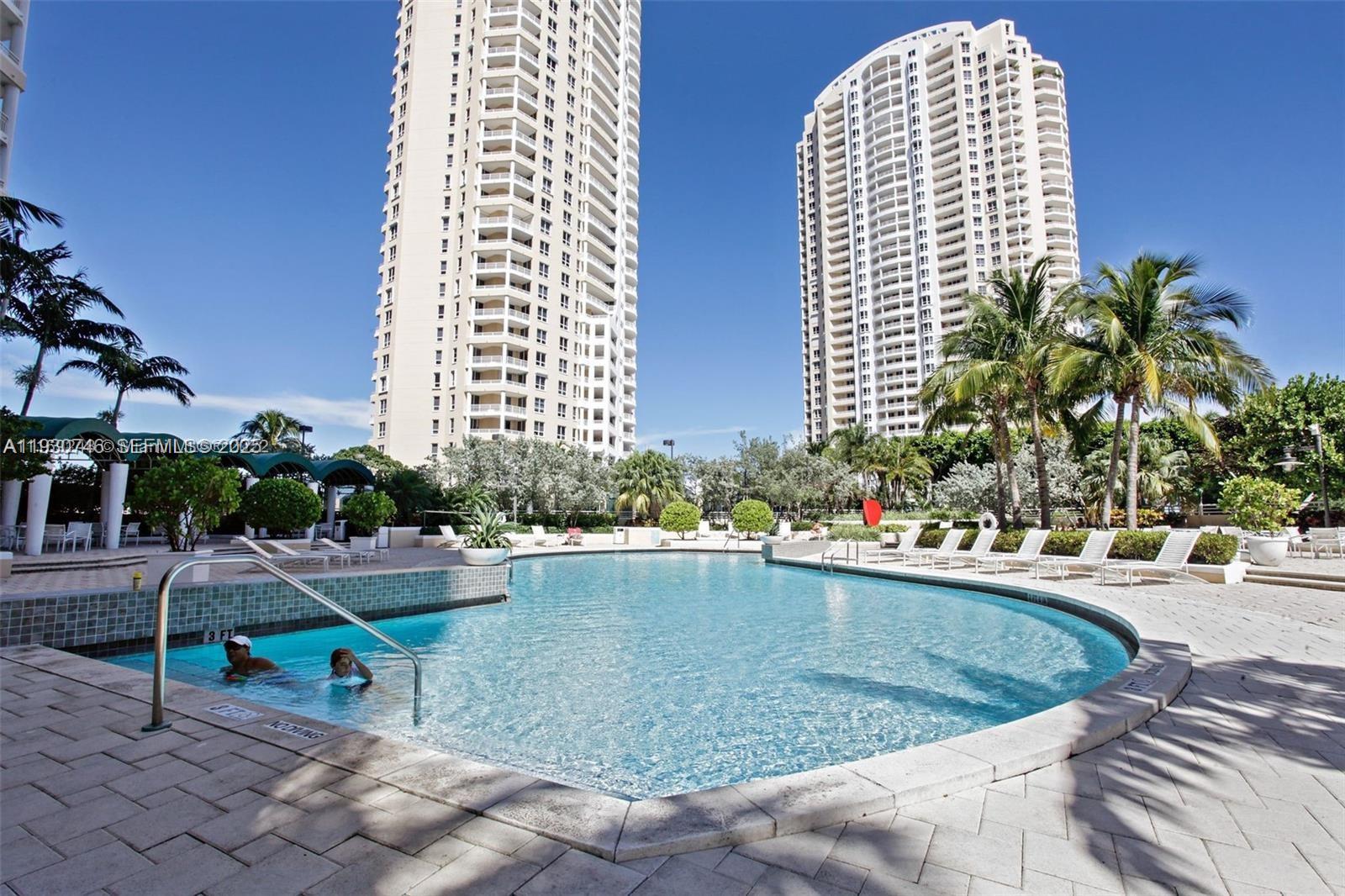 888 Brickell Key Drive, Unit 601 Miami, FL 33131 - Photo 24 of 36 a view of swimming pool with outdoor seating