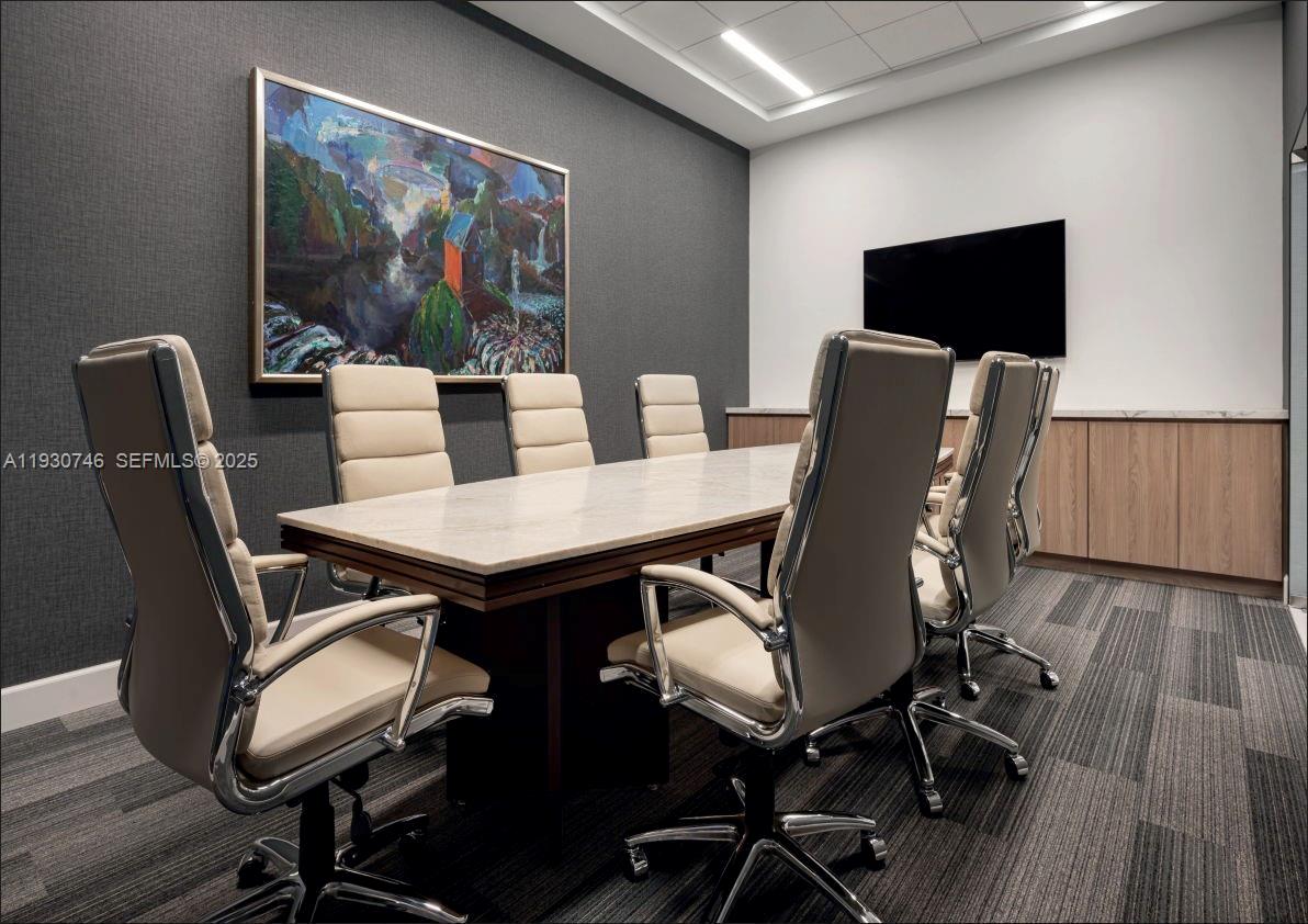 888 Brickell Key Drive, Unit 601 Miami, FL 33131 - Photo 35 of 36 a view of a dining room with furniture and wooden floor