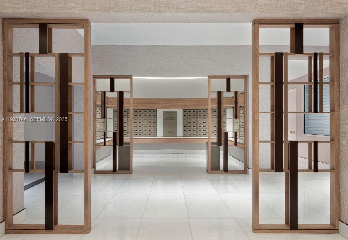 888 Brickell Key Drive, Unit 601 Miami, FL 33131 - Photo 36 of 36 a view of lobby with furniture and large window