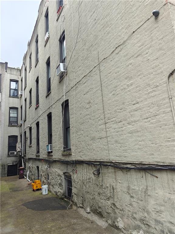 543 41st Street Brooklyn, NY 11232 - Photo 4 of 9 a view of swimming pool with building in background