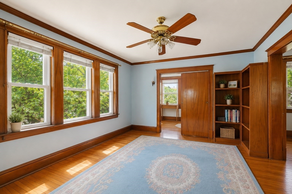 157 Elm Street Somerville, MA 02144 - Photo 6 of 19 a view of an empty room with closet and a window