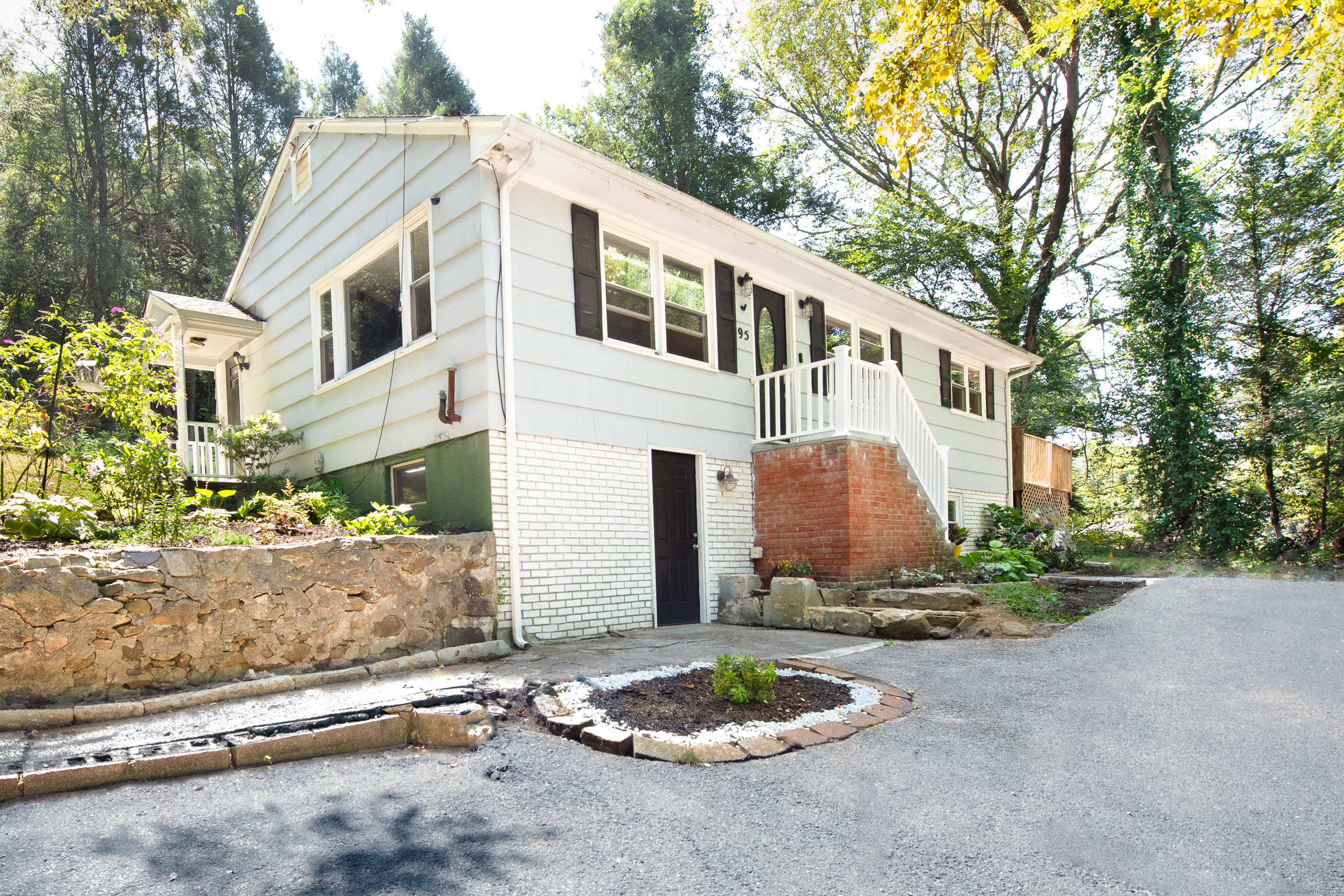 95 Squantuck Road Seymour, CT 06483 - Photo 1 of 1 a front view of a house with a yard and outdoor seating