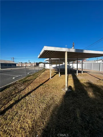 a view of a swimming pool with an outdoor seating