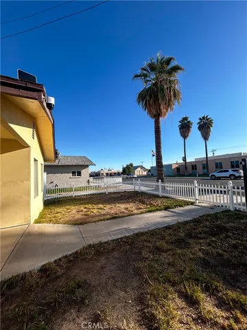 a view of a swimming pool with a yard