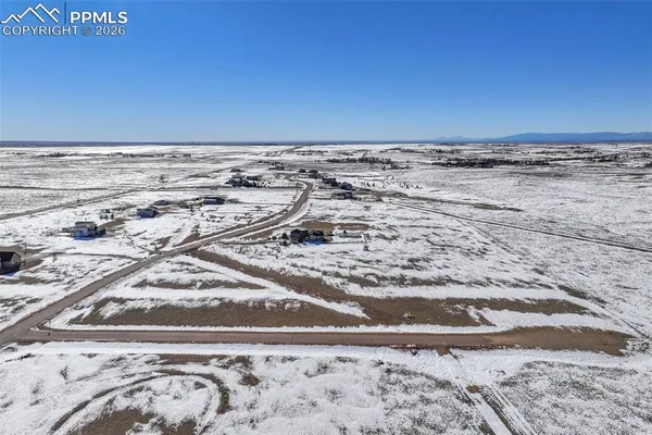 a view of a water with a building in the background
