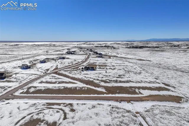 a view of a water with a building in the background