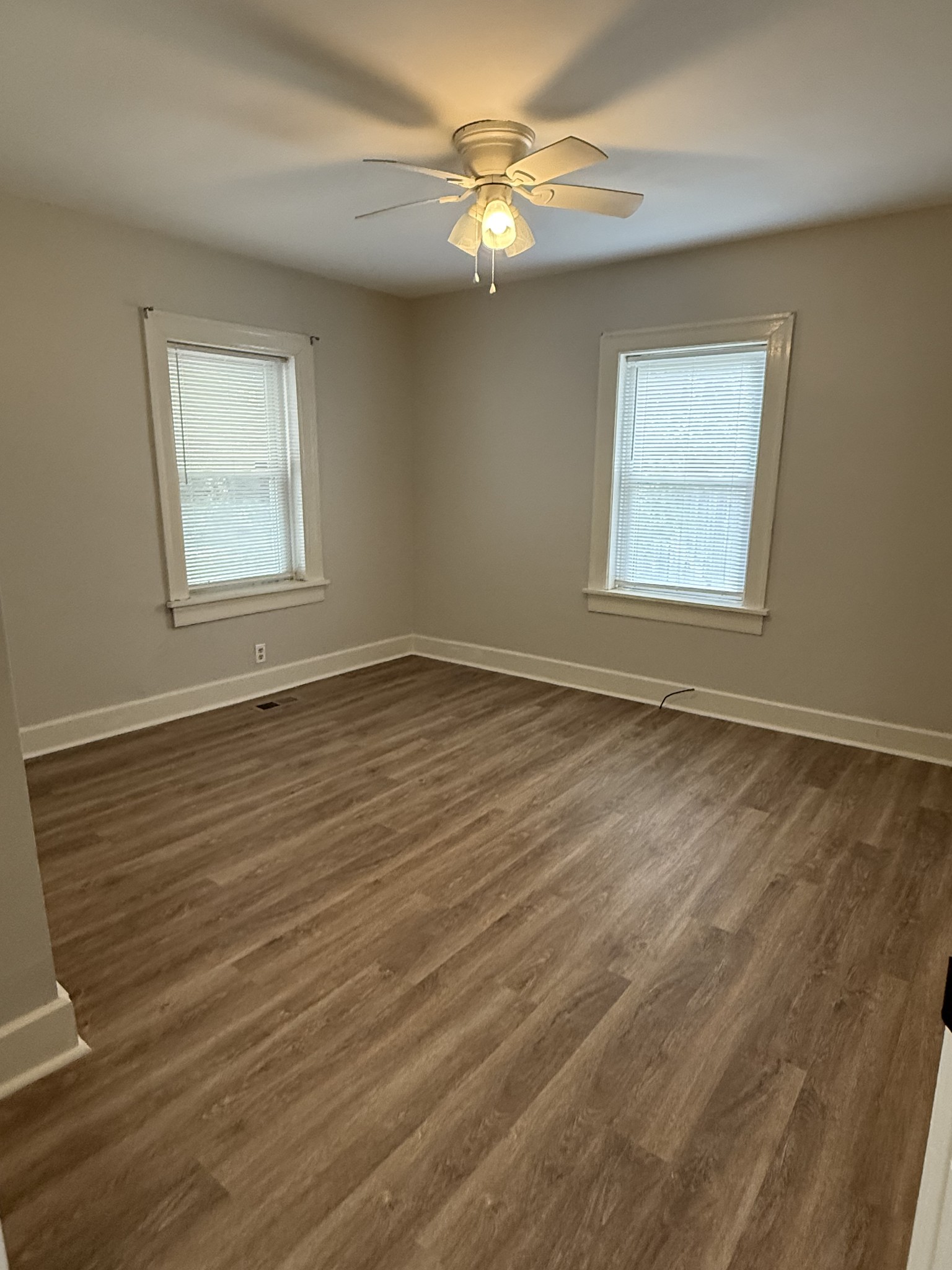 428 2nd Avenue, Unit A Murfreesboro, TN 37130 - Photo 6 of 10 a view of an empty room with a window and wooden floor