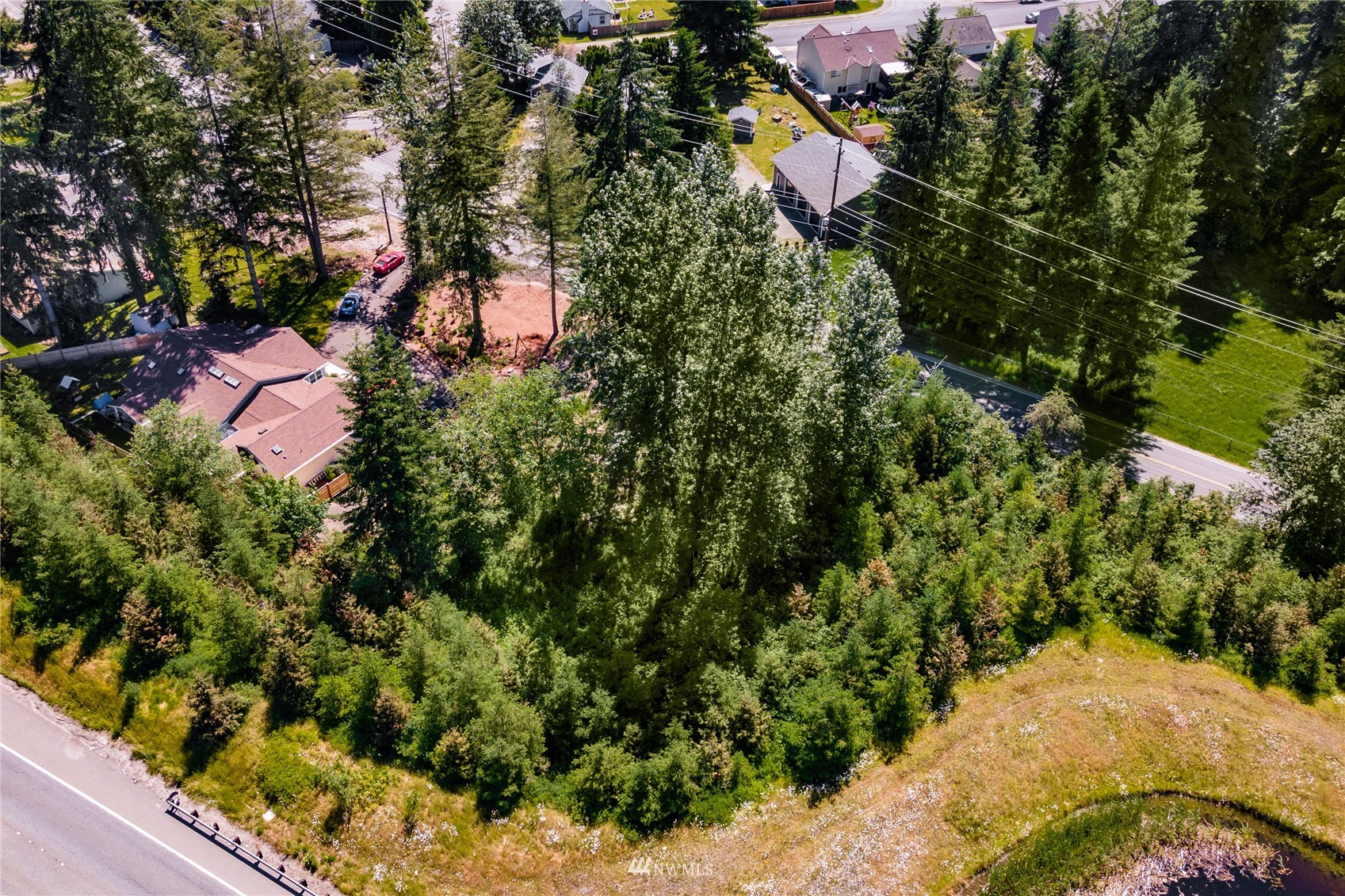 21540 Southeast Wax Road Maple Valley, WA 98038 - Photo 10 of 17 an aerial view of a house with a yard and trees