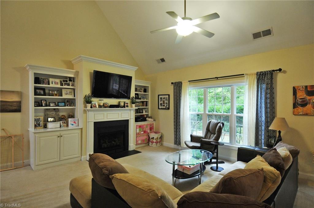 7363 Ridgecrest Trail Lewisville, NC 27023 - Photo 4 of 20 Den with gas fireplace, built-ins and vaulted ceiling