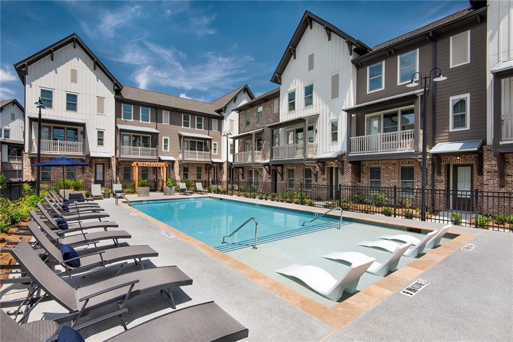 1545 Whitemarsh Road, Unit B1 Kennesaw, GA 30152 - Photo 5 of 46 a view of a building with swimming pool and sitting area