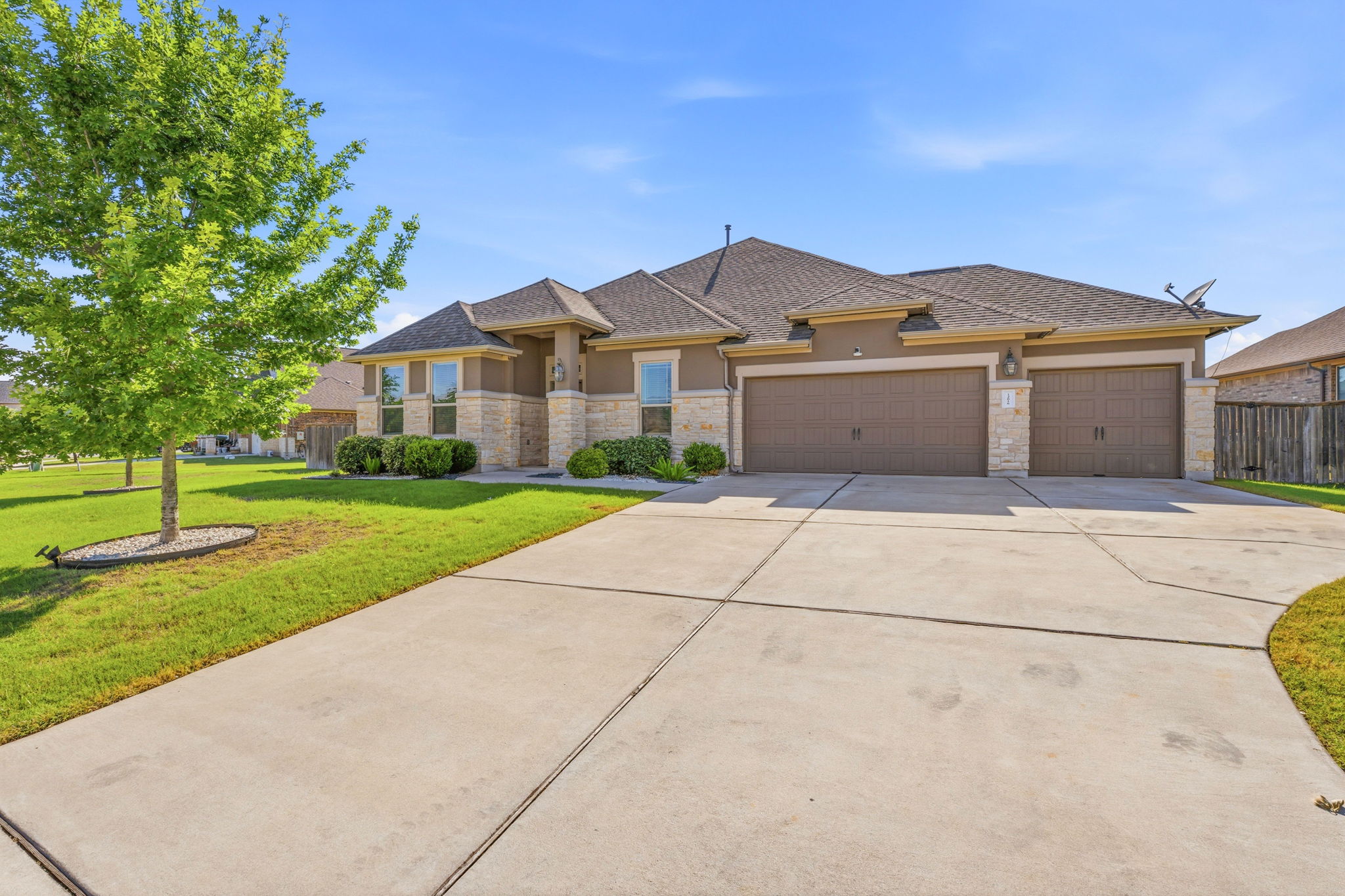 12616 Twisted Root Drive Manchaca, TX 78652 - Photo 7 of 36 Built in 2019 by M/I Homes, the curb appeal lands instantly with Craftsman-inspired architecture, stone masonry, Hardi siding, lush irrigated landscaping, and a three-car garage.