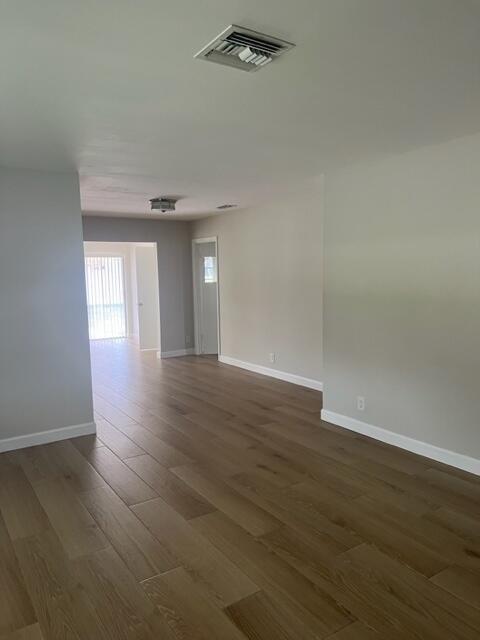 500 Northwest 53rd Street Boca Raton, FL 33487 - Photo 2 of 13 a view of an empty room with wooden floor