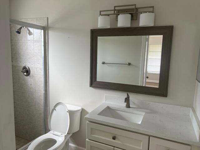 500 Northwest 53rd Street Boca Raton, FL 33487 - Photo 6 of 13 a bathroom with a toilet sink and mirror