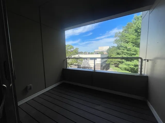 a view of balcony with wooden floor