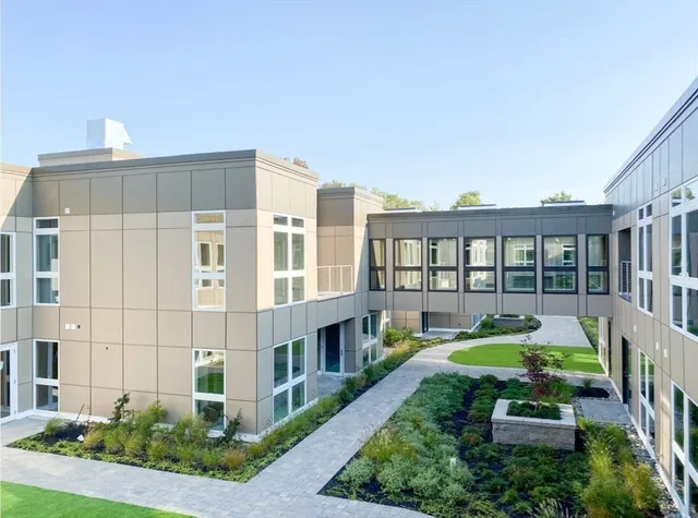 a view of a building with a yard