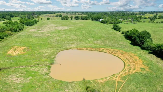 a view of a lake with a big yard