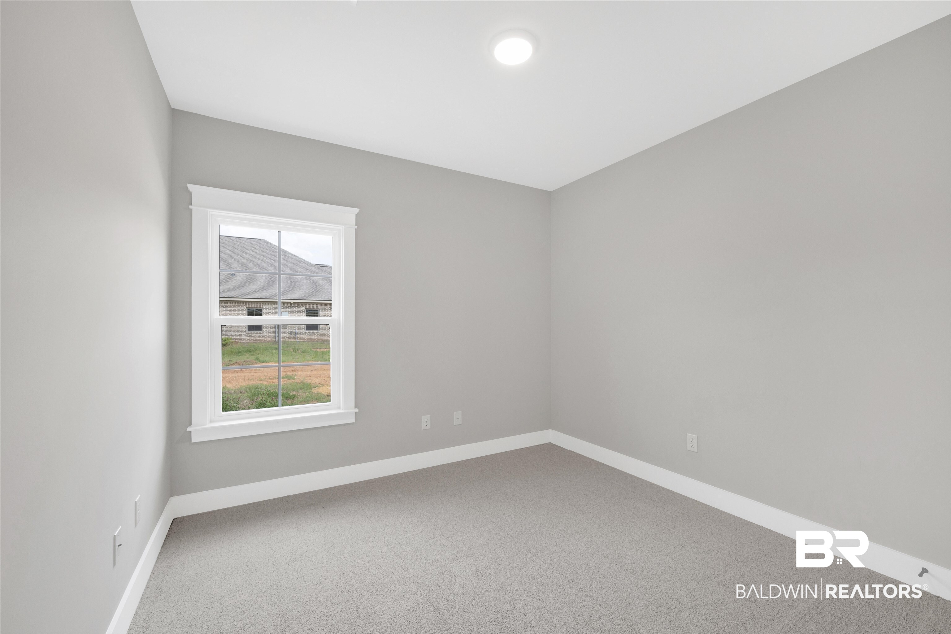 27315 Patch Pl Loop Daphne, AL 36526 - Photo 18 of 43 Spare room with light colored carpet and baseboards