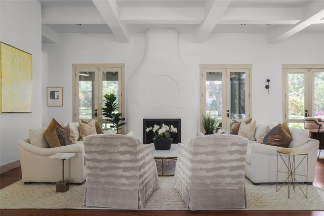 a living room with fireplace furniture and a couch