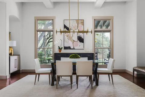 a dining room with furniture and window