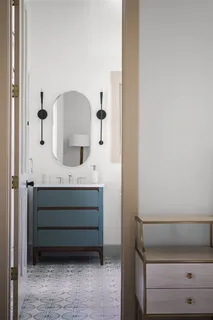a bathroom with a vanity and a mirror