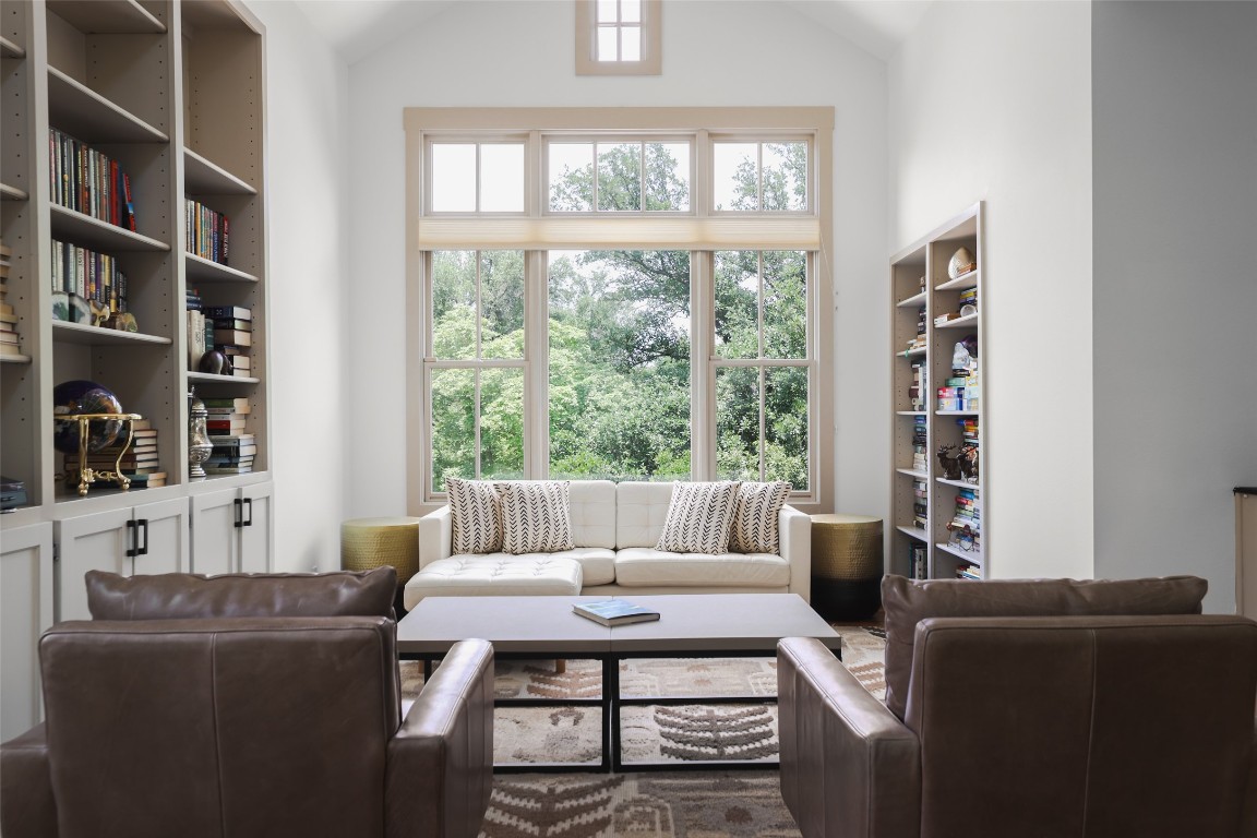 3020 Maravillas Loop Austin, TX 78735 - Photo 23 of 35 a living room with furniture a bookshelf and a window