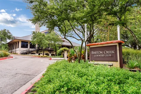 a view of outdoor space with sign board and garden