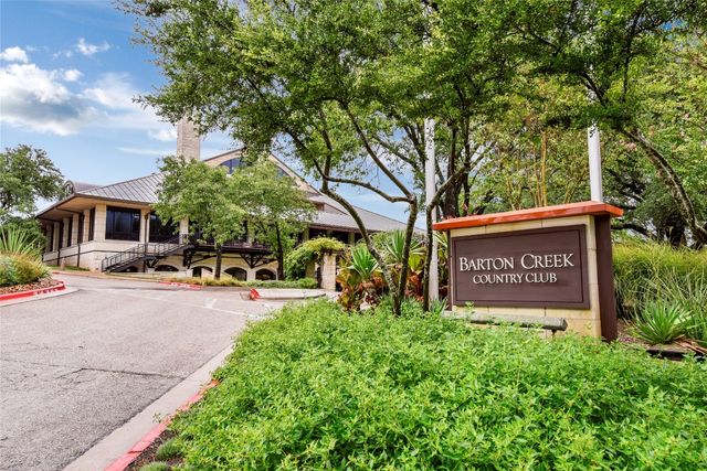 a view of outdoor space with sign board and garden