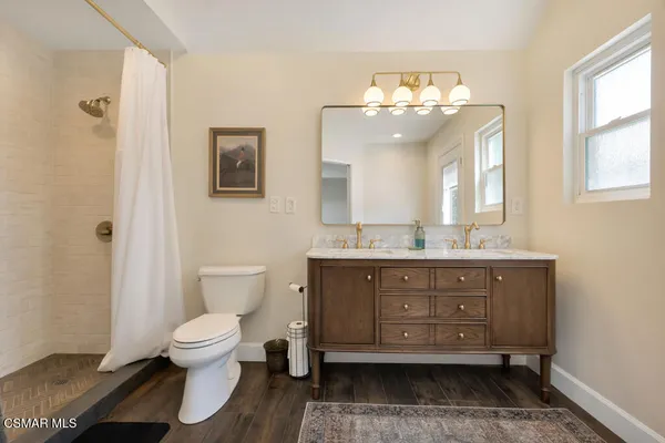 a bedroom with a bed and a table