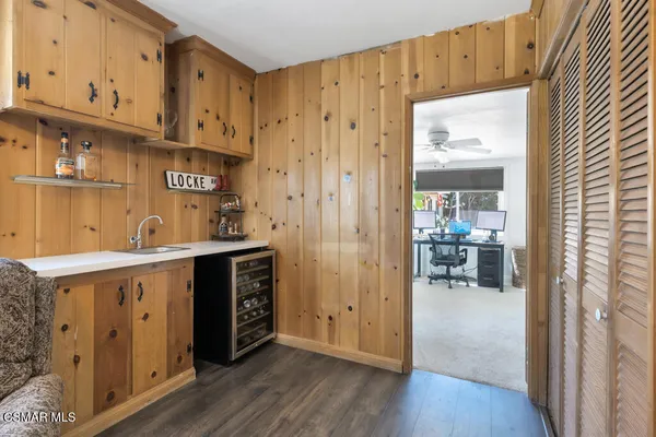 a backyard of a house with barbeque oven