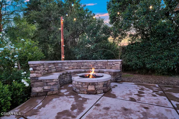 an aerial view of a house with a garden and trees