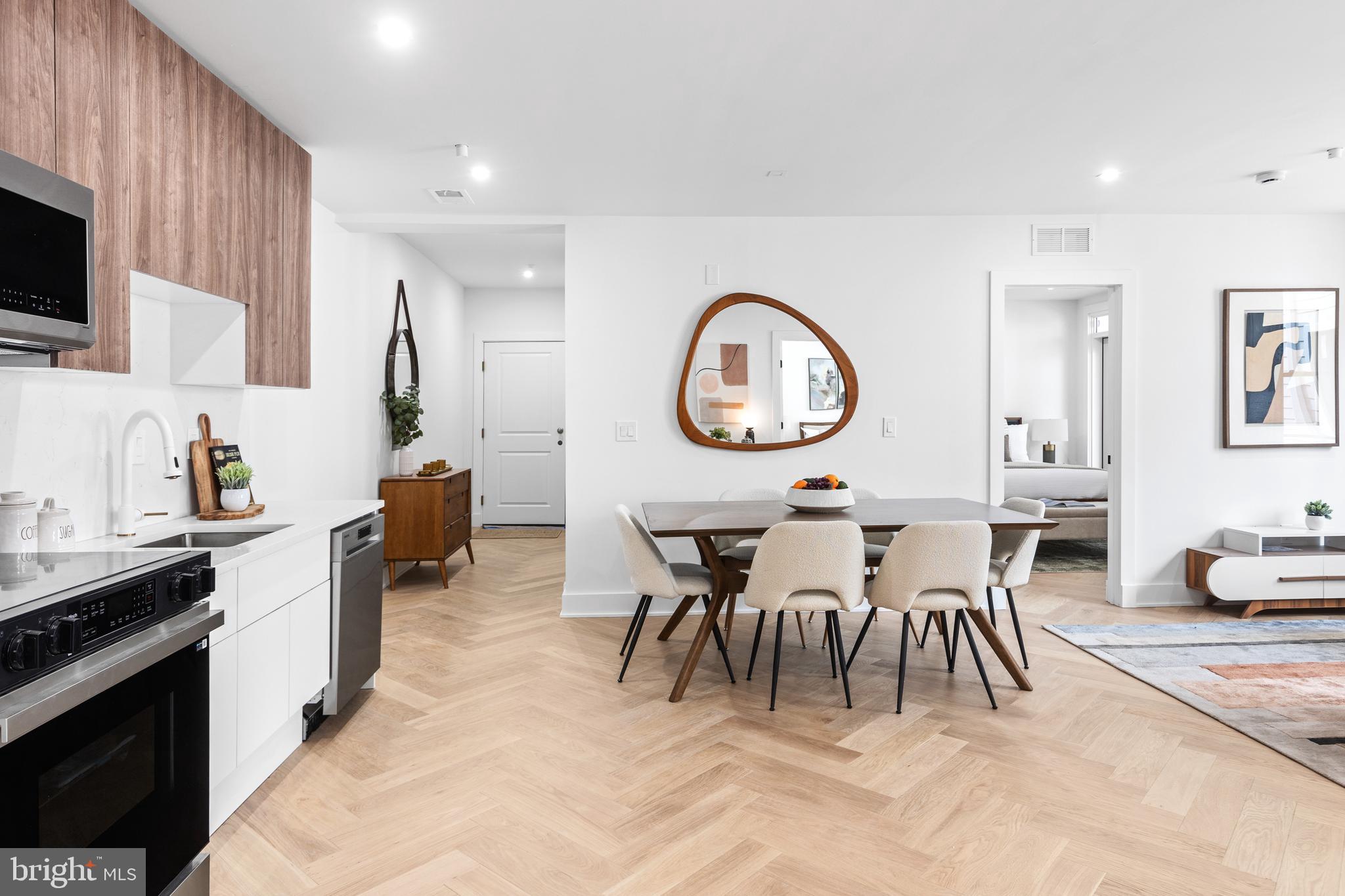 1124 Florida Street Northeast, Unit 210 Washington, DC 20002 - Photo 14 of 26 a group of people sitting in a living room