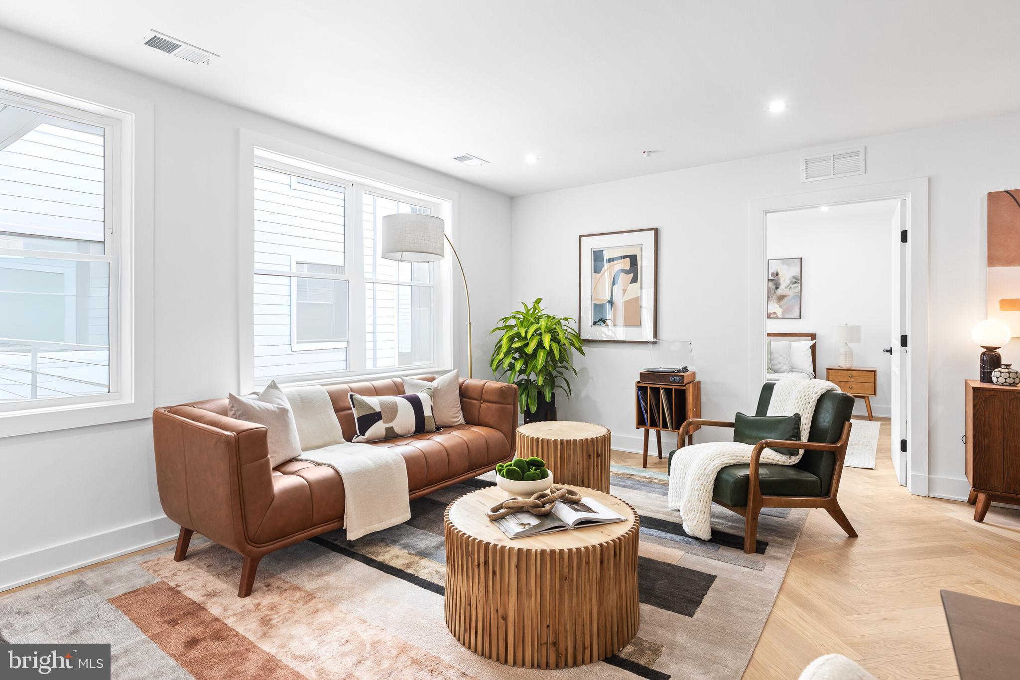1124 Florida Street Northeast, Unit 210 Washington, DC 20002 - Photo 21 of 26 a living room with furniture and a large window