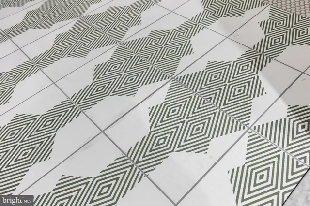 a view of a brick building next to a road