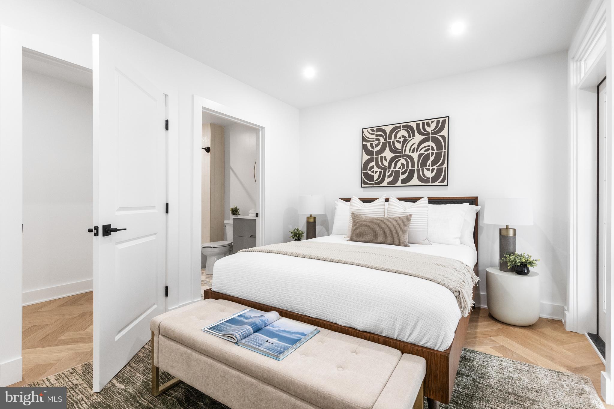 1124 Florida Street Northeast, Unit 210 Washington, DC 20002 - Photo 5 of 26 a bedroom with a bed and a table