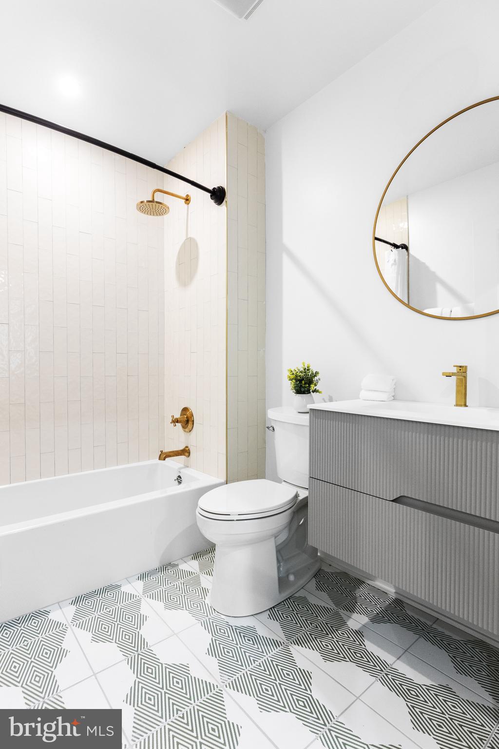 1124 Florida Street Northeast, Unit 210 Washington, DC 20002 - Photo 8 of 26 a bathroom with a toilet a sink and a shower