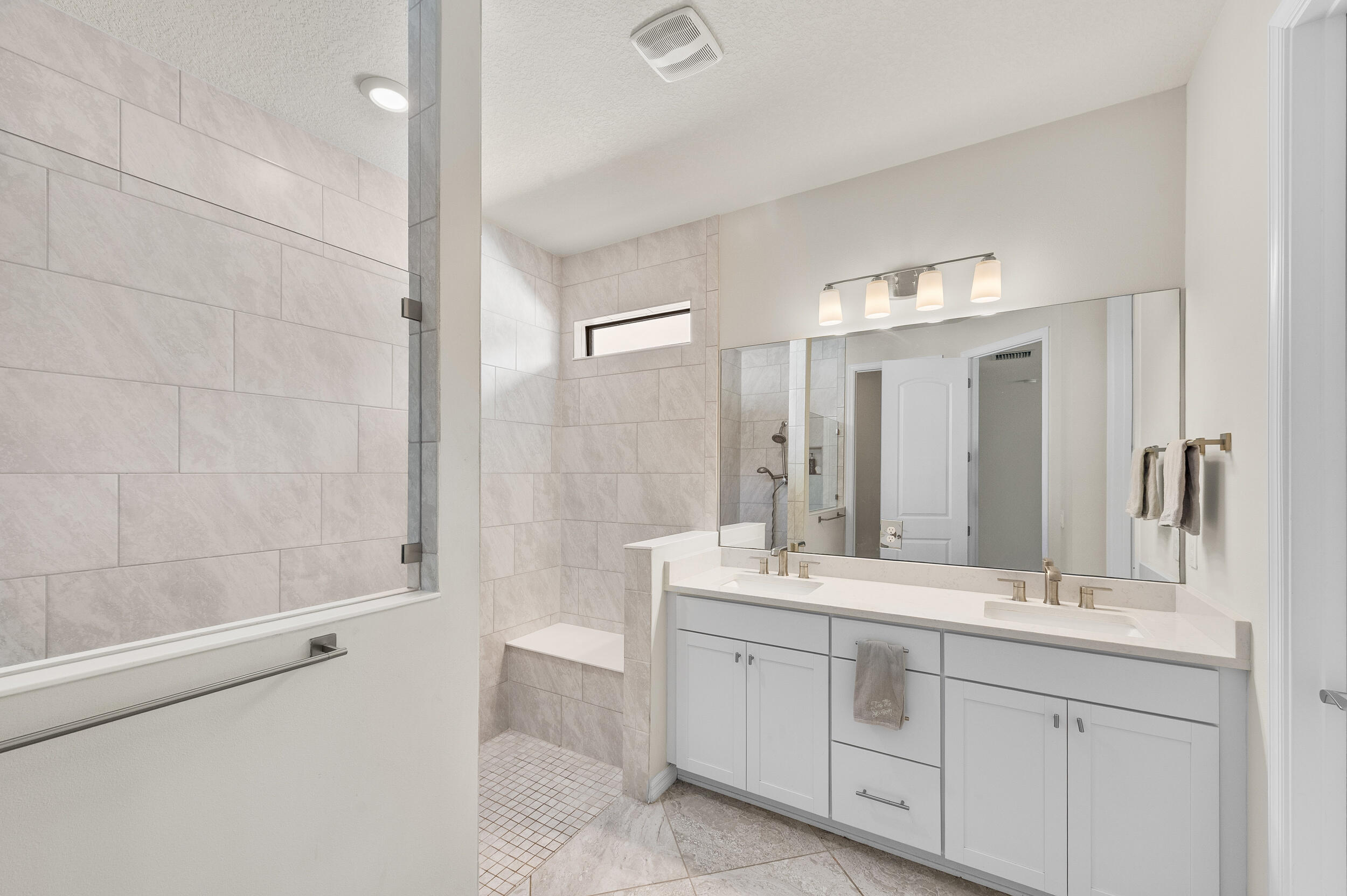 4762 Roldan Court Lake Worth, FL 33467 - Photo 22 of 41 a bathroom with a double vanity sink mirror double and shower