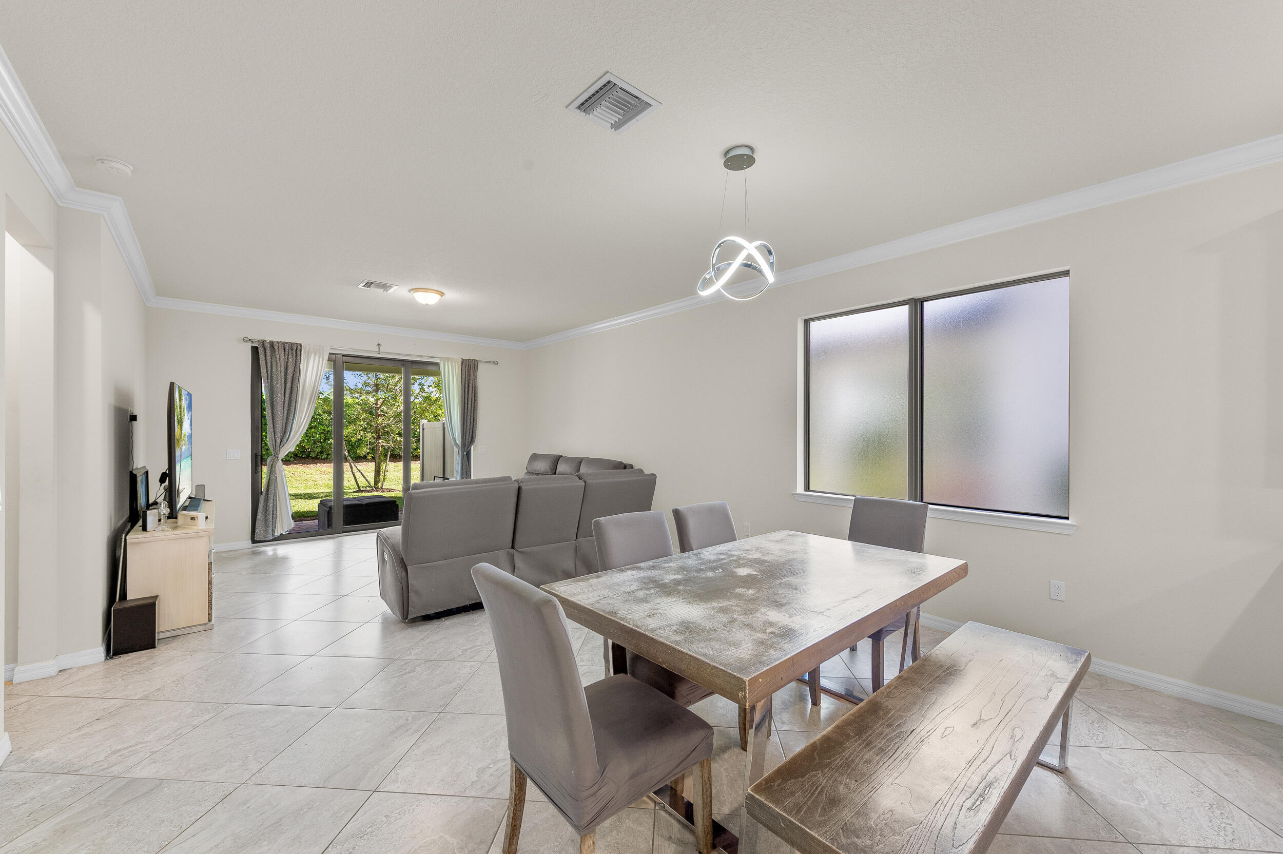 4762 Roldan Court Lake Worth, FL 33467 - Photo 10 of 41 a living room with furniture and a large window